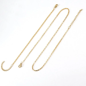Detailed macro view of 18K gold box chain necklace with lobster clasp and adjustable link
