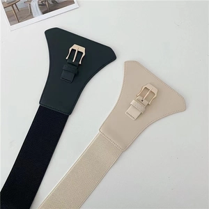 Detail of black and beige wide elastic waist belts with premium gold metal buckles