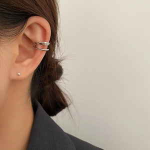 Minimalist silver double-layered ear bone clip for non-pierced ears shown on model