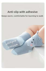 Detailed view of non-slip rubber grips on the sole of baby cartoon knit socks