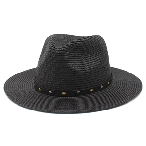 Detail of black woven fedora hat featuring gold and silver metallic rivet embellishments