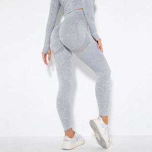 Close-up of seamless acid wash yoga leggings showing breathable mesh and peach lift texture