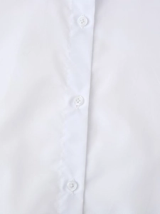 Detailed close-up of white sporty shirt showing neat stitching and white four-hole buttons