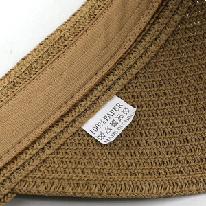 Detail view of the sun hat inner sweatband with 100% paper material and wash care label