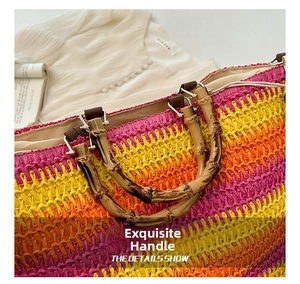 Detail showing the bamboo handle and colorful woven texture of the beach tote bag