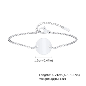 Macro view of polished stainless steel round tag bracelet showing size and S.STEEL stamp