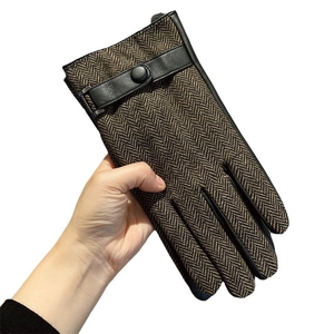 Men's winter herringbone gloves with leather palms and adjustable snap strap detail