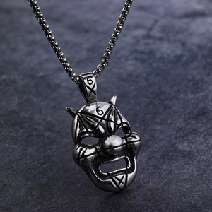 Detailed view of Viking style evil clown mask pendant with vintage silver finish