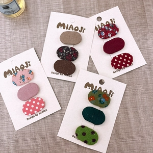 Set di 3 piccoli fermagli ovali in tessuto con motivi floreali per bambine
