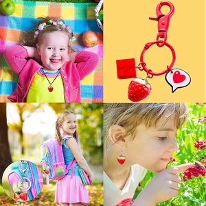 Collage of 3D resin strawberry jewelry set including necklace, earrings and keychain