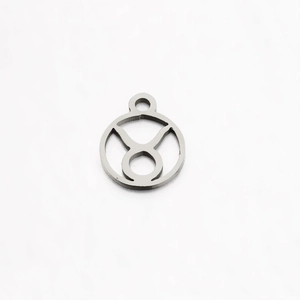 Polished stainless steel Taurus zodiac pendant with cutout design on white background