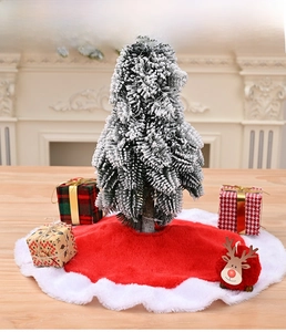 Macro detail of red velvet Christmas tree skirt with plush white faux fur border