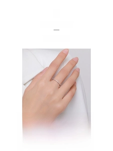 Detail of minimalist S925 silver ring with pave-set white cubic zirconia stones