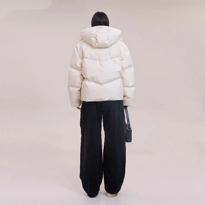 Back view of a white hooded down jacket showing its oversized silhouette and soft texture