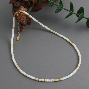 Elegant white square shell beaded necklace with gold plated brass accents and extension chain