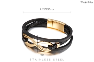 Dettaglio del bracciale in pelle nera intrecciata con ciondolo infinito in acciaio dorato
