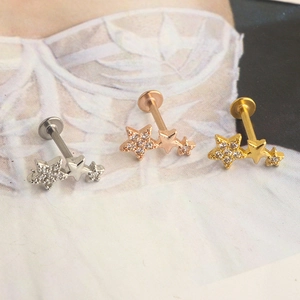 Star-shaped flat back studs in silver, gold, and rose gold with pavé-set zircons