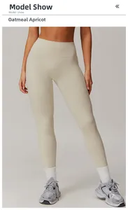 Detailed close-up of high-waist seamless yoga pants in oat beige with elastic fabric