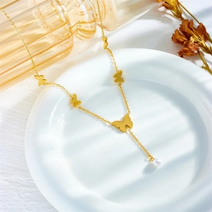 Elegant gold titanium chain necklace featuring butterfly charms and a pearl drop pendant