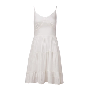 Close-up of white cotton tiered dress with slim straps and ruffled V-neckline details