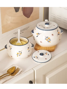 Japanese ceramic lard jar with blue floral pattern and spoon in kitchen setting