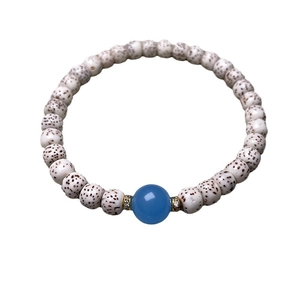 Xingyue Bodhi bead bracelet with blue agate and gold accents on a white background