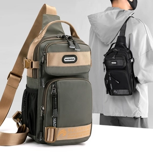 Green and black men's crossbody bag with multiple compartments and adjustable strap