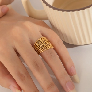 Macro shot of 18K gold plated multi-layer wide band ring with chic sequin detail
