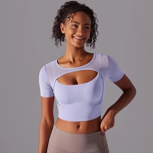 Detail of lavender sports top with mesh stitching and front cutout for yoga and fitness