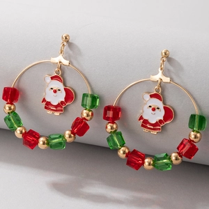 Detailed macro view of Christmas hoop earrings with Santa charm and colorful beads