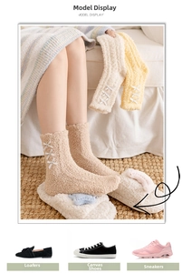 Detail of coral fleece socks with ribbon bows in cream, beige, and nude pink colors