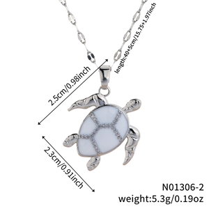 Detailed view of silver turtle pendant with size 2.5x2.3cm and weight 5.3g measurements
