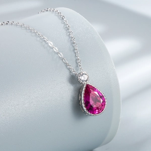 S925 sterling silver necklace featuring a vibrant magenta teardrop crystal pendant