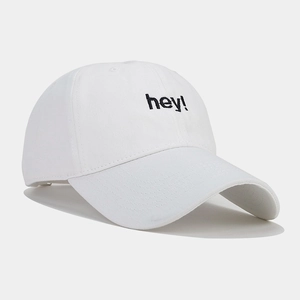 Detailed side view of white cotton baseball cap with black hey embroidery lettering