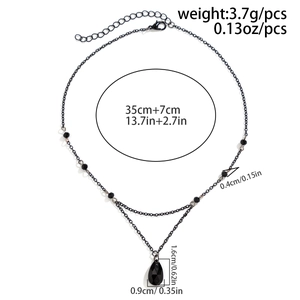 Detail view of gothic black tassel necklace showing 35cm chain length and 3.7g weight