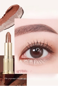 Detail of 05 Orange Brown shimmer eyeshadow stick showing eye application and texture
