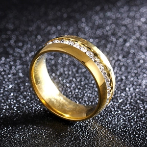 Macro detail of 6mm golden titanium ring band featuring inlaid round clear diamonds