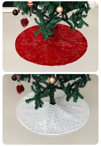 Detail of red and white velvet Christmas tree skirts with golden star patterns