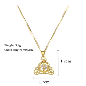 Detailed view of pumpkin carriage pendant with crystal pavé and size measurements