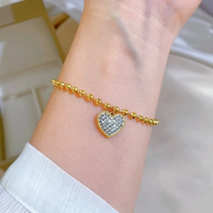 Titanium steel gold beaded chain bracelet with a sparkling crystal heart pendant for women