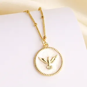 Elegant gold necklace with white enamel peace dove pendant and beaded chain for women