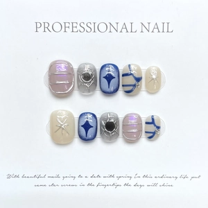 Handmade press-on nails featuring evil eye and star designs with metallic mirror finish