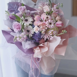 Elegant pearl fishtail ribbon on purple bouquet with gauze for floral gift wrapping