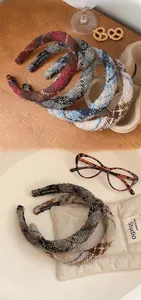 Detail of handmade vintage plaid tweed headbands with high top design in various colors