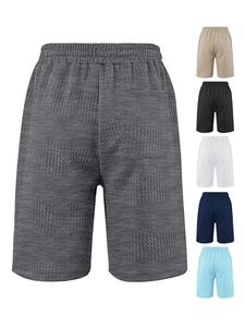 Detail of dark grey waffle texture men's shorts with side pocket and multi-color swatches