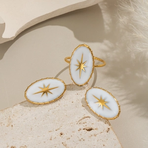 Parure bague et boucles d'oreilles ovales motif étoile en acier doré