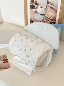 Macro view of quilted heart pattern and bunny prints on cotton tissue dispenser bag