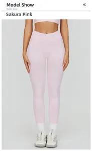 Detail of high waist seamless yoga leggings in cherry blossom pink shown on a model
