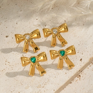 Vintage bow earrings with heart-shaped zircon stones in green and clear crystals