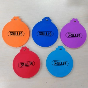 Detailed view of silicone pet food can lids in five colors with cute paw hanging holes